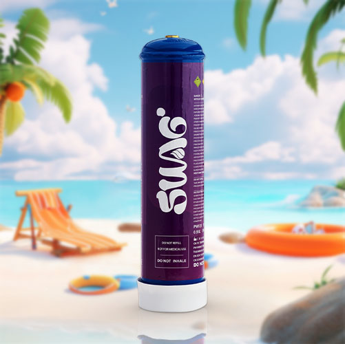 The image shows a massive cream charger canister with the branding "SSES" in the center of a serene beach landscape. The canister is deep purple and white, towering over the surrounding beach scenery, which includes palm trees, a sun chair, a beach hat, and an inflatable orange life ring. The clear blue sky and calm sea in the background convey a peaceful and sunny day at the beach. The cream charger is marked with cautionary notes such as "Food Grade," "Do not inhale," and has a prominent yellow caution symbol at the top. The juxtaposition of the cream charger with a beach setting creates a playful and surreal visual.