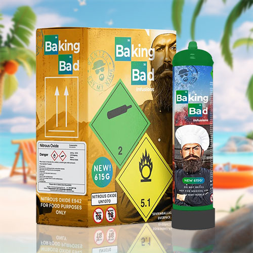 The image displays a collection of items related to "Baking Bad" themed cream chargers. There's a large canister with a label featuring a character resembling a cook or chemist, and the box next to it carries similar branding. The box has various hazard symbols indicating that it contains nitrous oxide, which is specified for food purposes only, and it's labeled "NEW 615g," hinting at a new product size. Safety warnings, such as flammability and age restriction notices, are prominently displayed. This setup is placed against a tropical beach background, complete with palm trees and beach gear, creating a playful and contrasting visual narrative that combines the culinary use of cream chargers with a relaxed, leisurely environment.